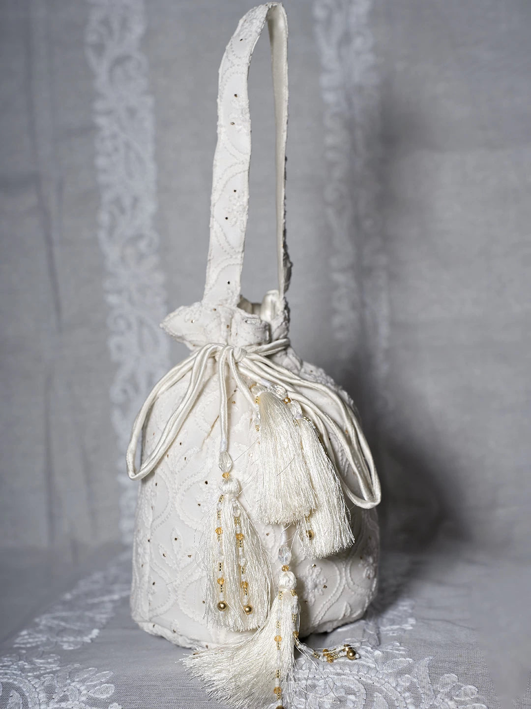 Ada Hand Embroidered Off White Viscsoe Georgette Lucknowi Chikankari Potli Bag With Mukaish Work 01A513055