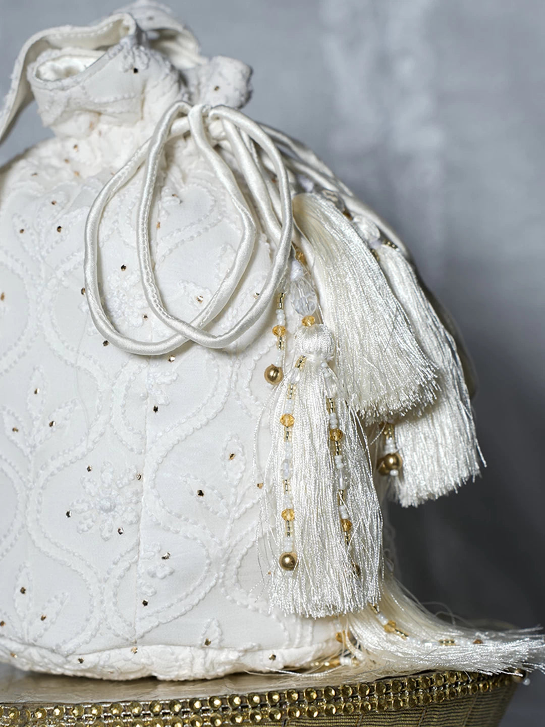 Ada Hand Embroidered Off White Viscsoe Georgette Lucknowi Chikankari Potli Bag With Mukaish Work 01A513055
