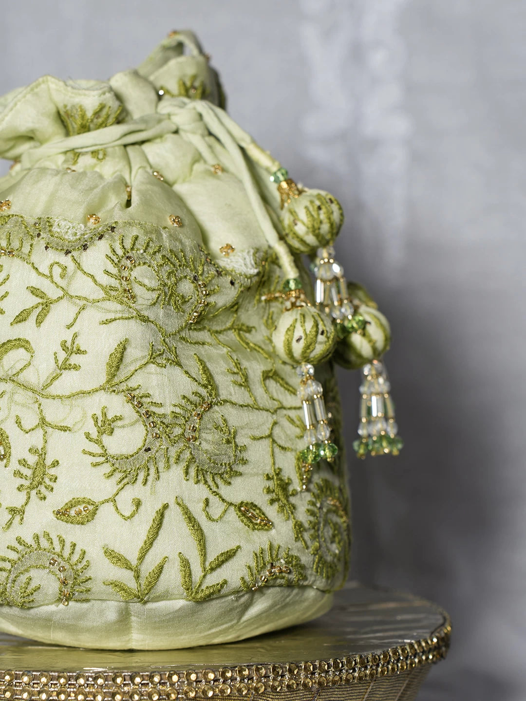 Ada Hand Embroidered Tea Green Organza Lucknowi Chikankari Potli Bag With Cutdana Work 01A498899