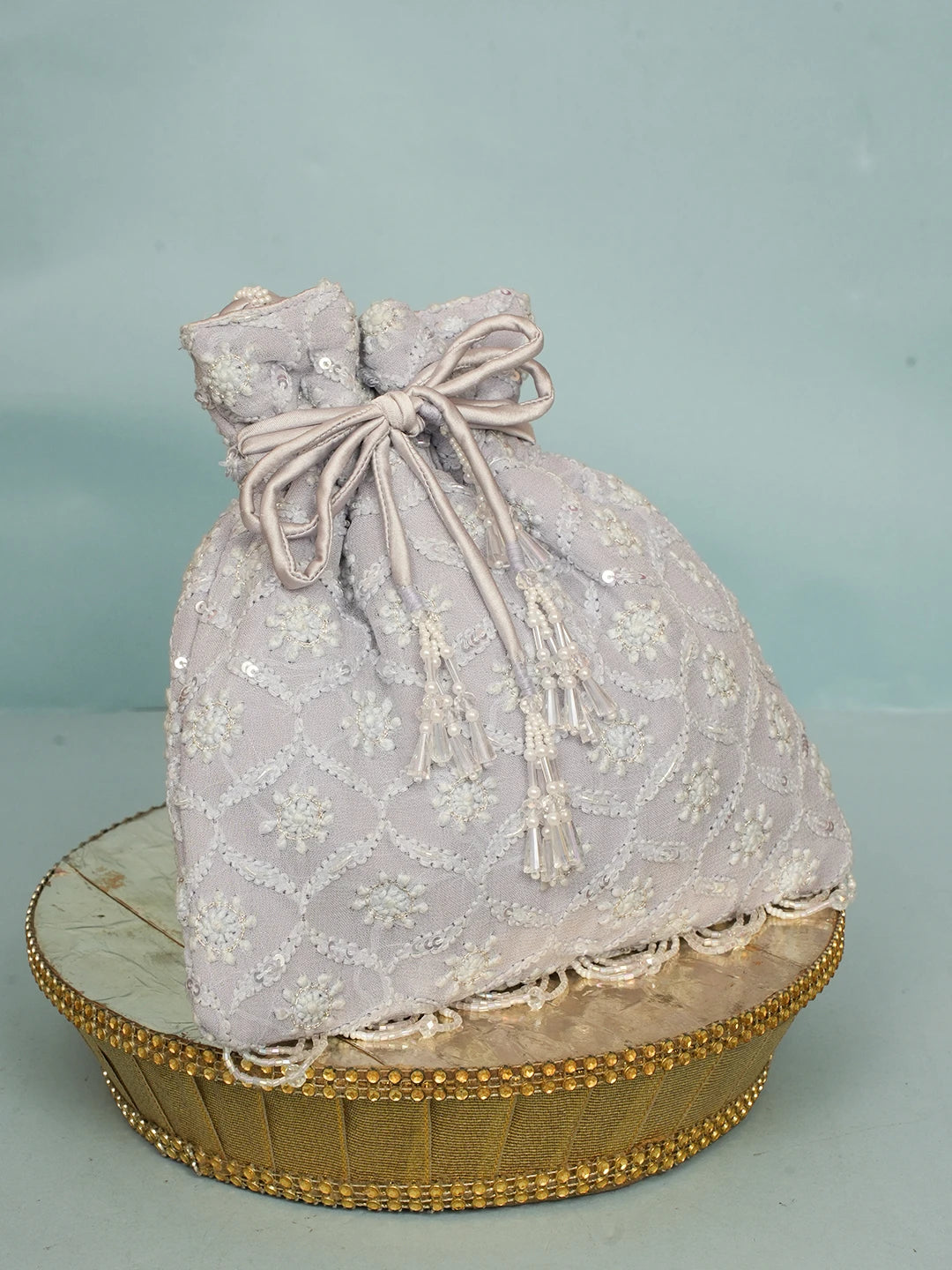 Ada Hand Embroidered Lavender Viscose Georgette Lucknowi Chikankari Potli Bag With Sequinned Work 01A560447