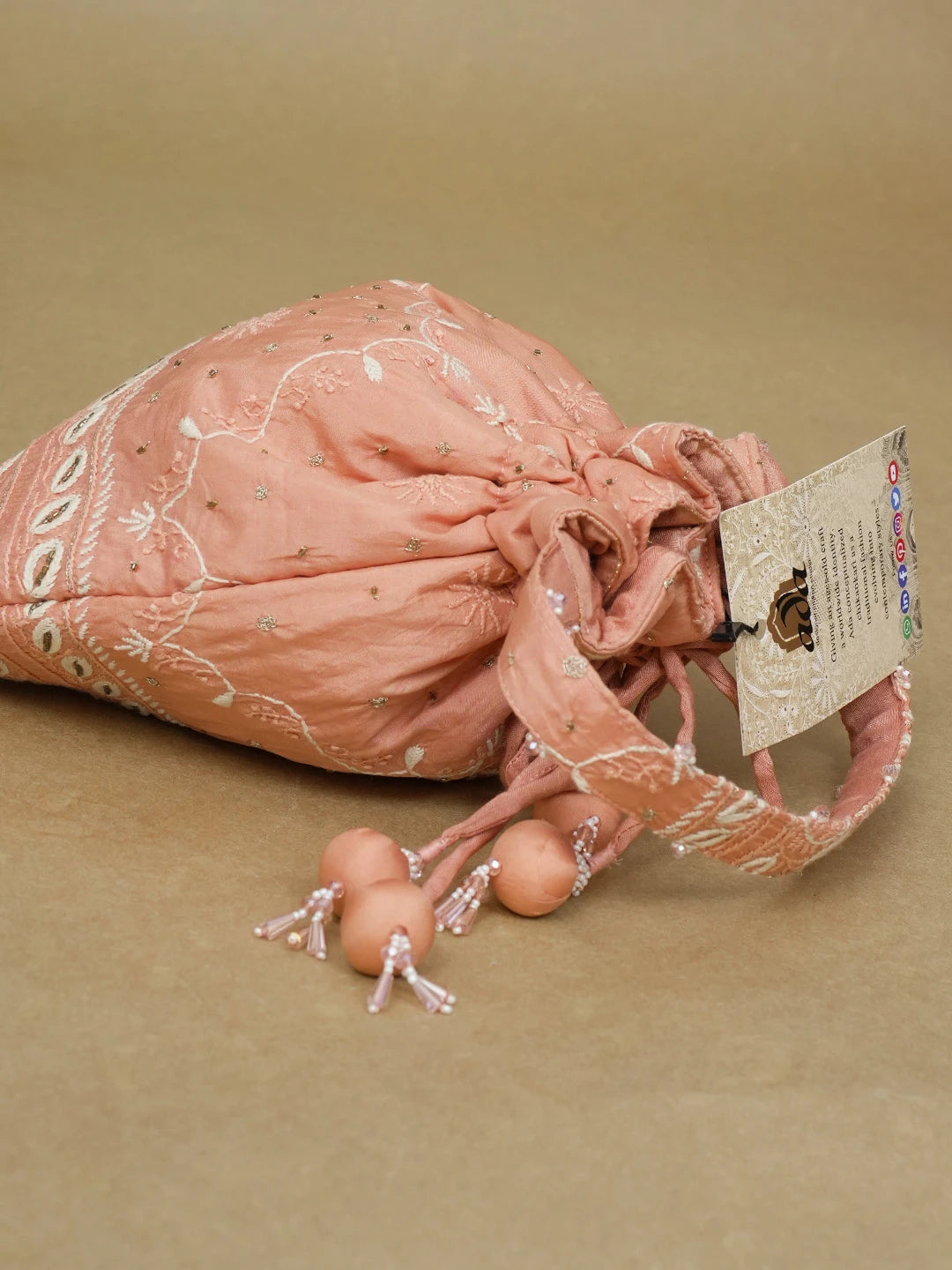Ada Hand Embroidered Dusty Peach Silk Lucknowi Chikankari Potli Bag With Zari Work 01A603322