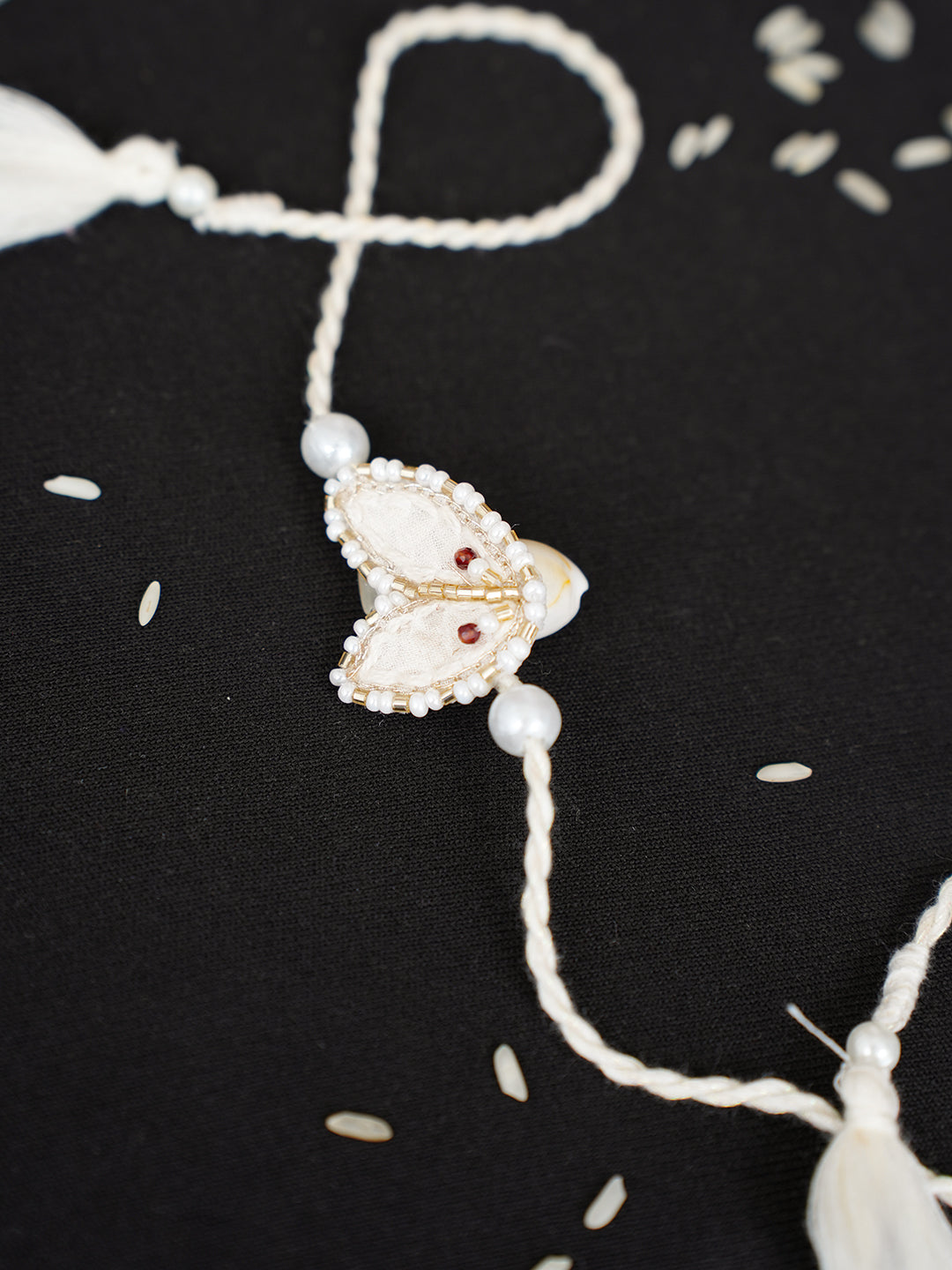 Ada Hand Embroidered Cream Cotton Raksha Sutra Rakhi With Cutdana Work_2