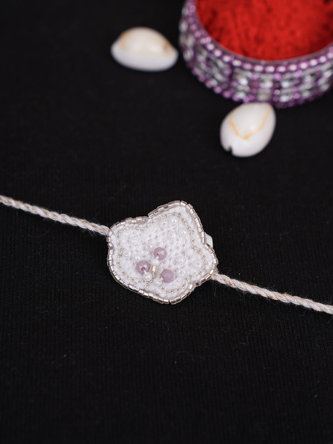 Ada Hand Embroidered White Cotton Raksha Sutra Rakhi With Cutdana Work_2